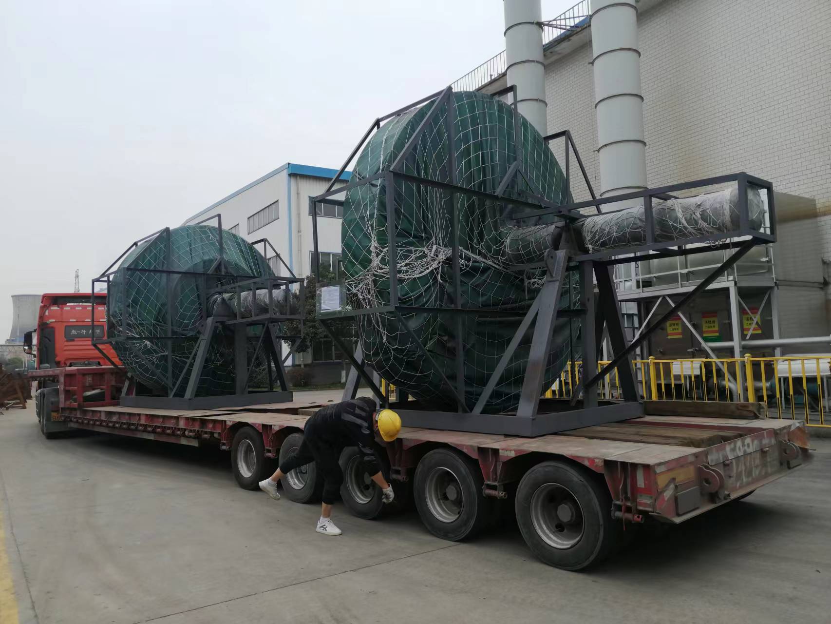 Two large protected rotor assemblies prepared for transport